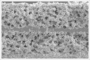 electron-microscope-photo-of-a-thin,-dense-layer-of-a-ceramic-electrolyte-that-goes-between-two-porous-layers-in-a-solid-state-battery